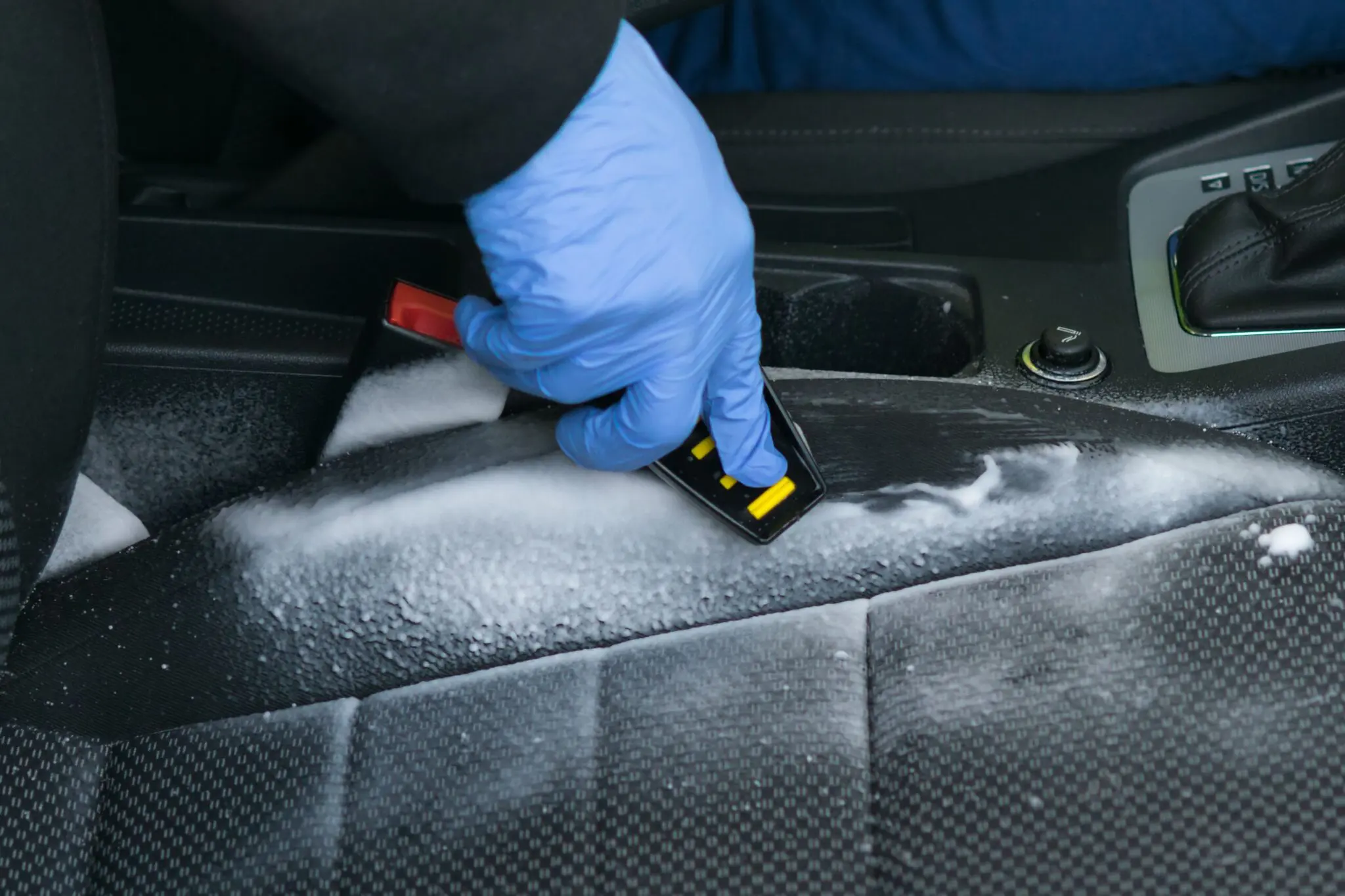 Scrubbing foam on car seat interior