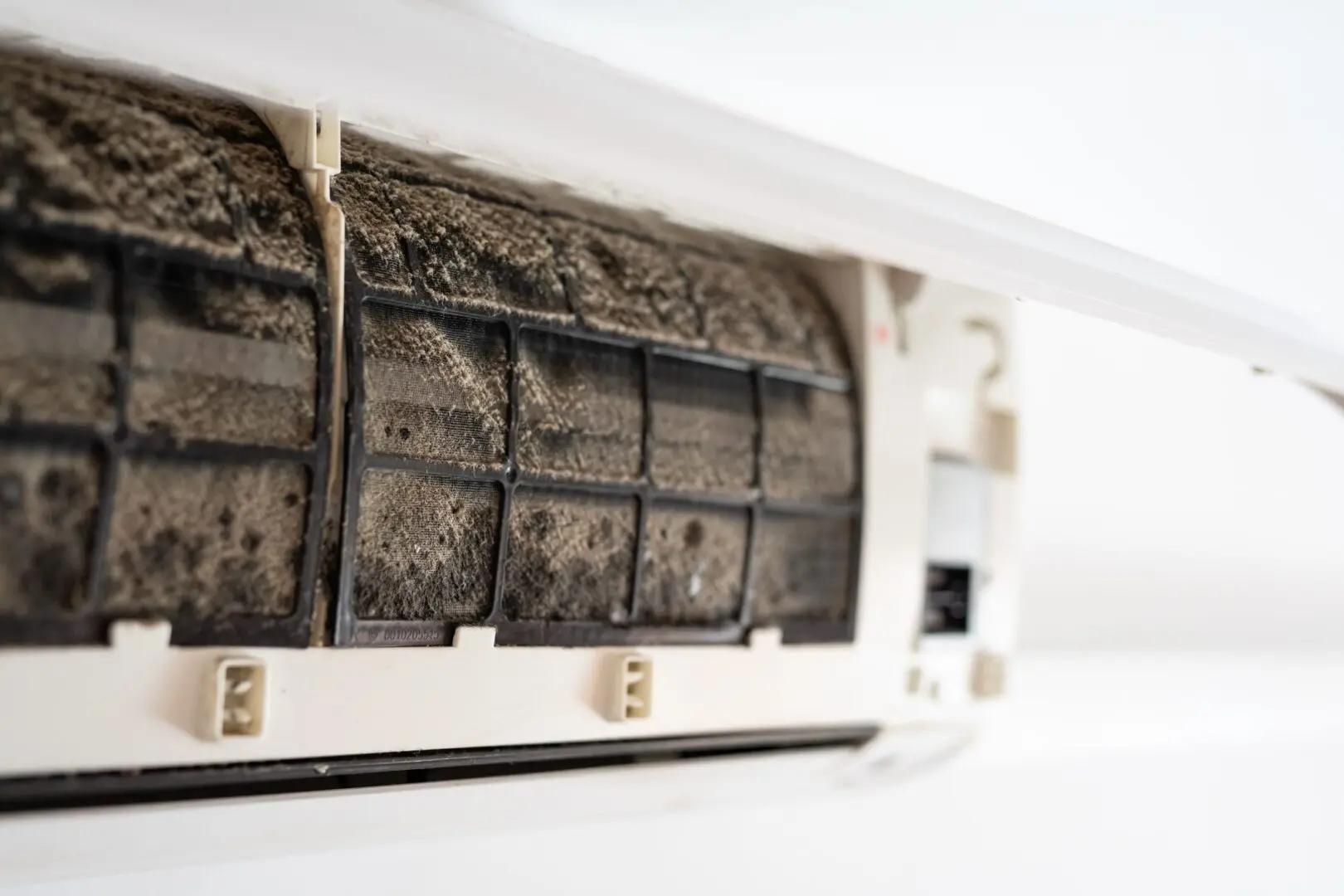 Clogged AC filter with dirt buildup