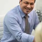 Smiling man in a blue shirt
