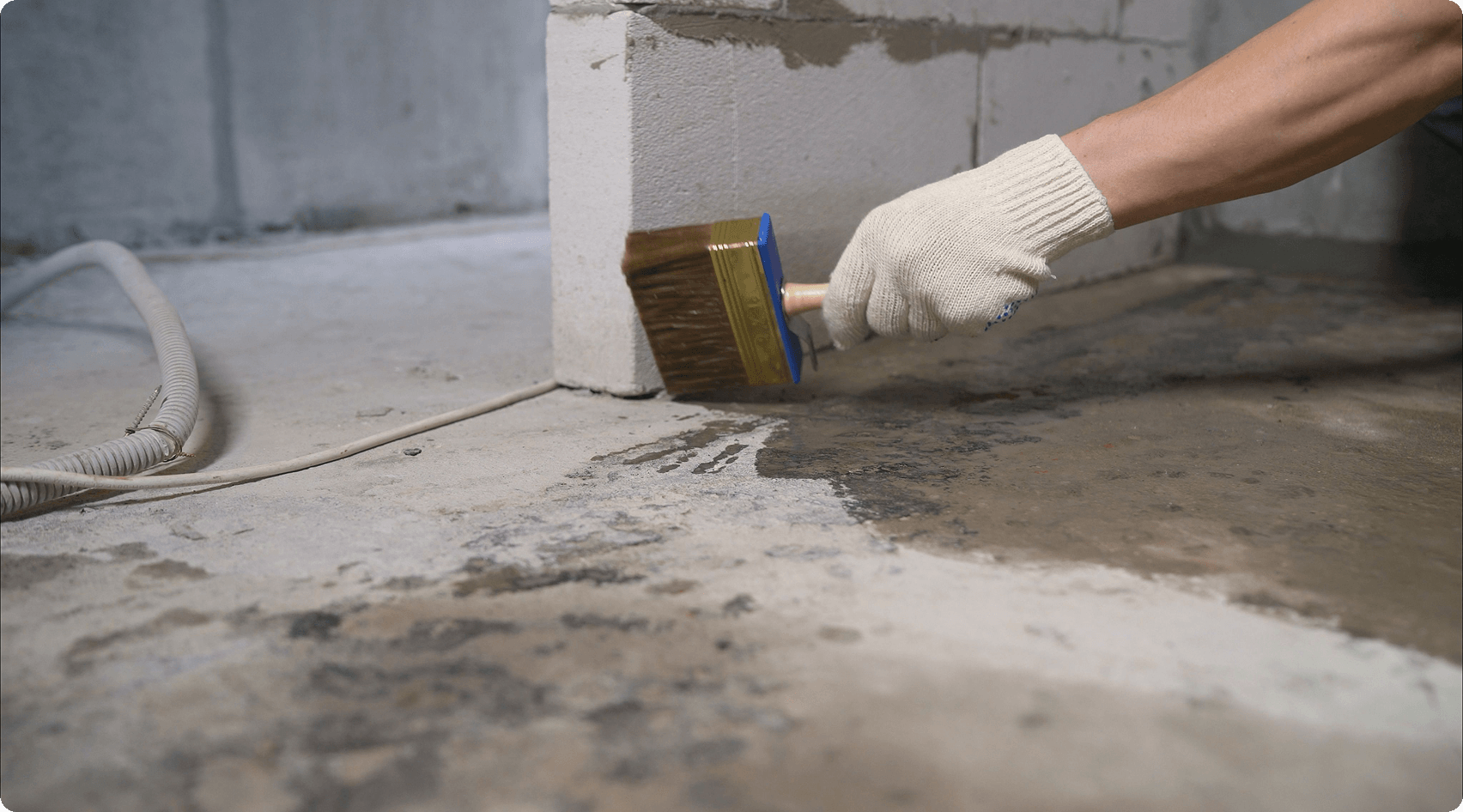 Painting concrete floor with brush