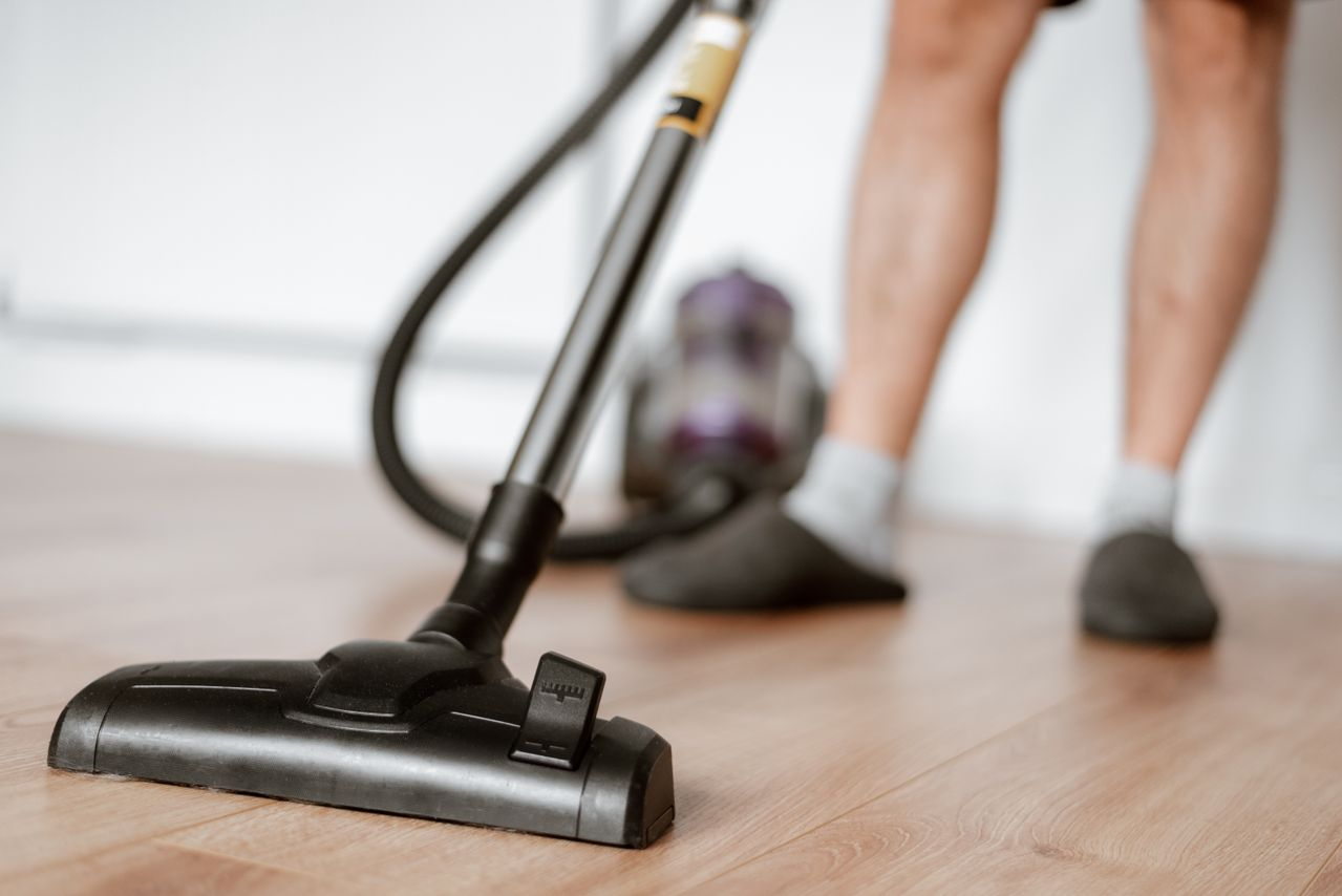 Cleaning floor with vacuum cleaner